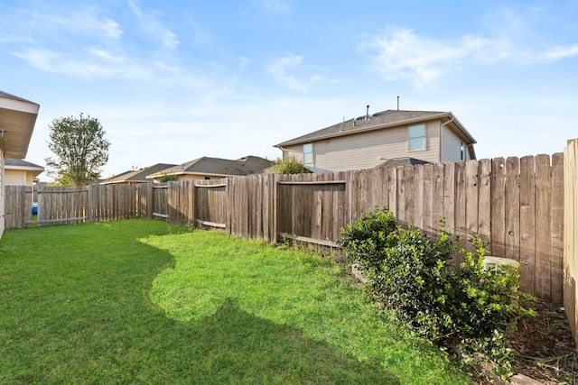 view of yard with a fenced backyard