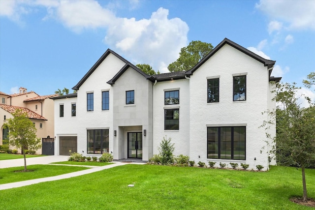 534 Lanecrest Ln, Houston, TX 77024 - view of front of home featuring driveway, a front lawn, and a garage