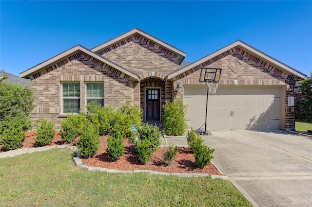 view of front of property with brick siding, a front yard, an attached garage, and driveway