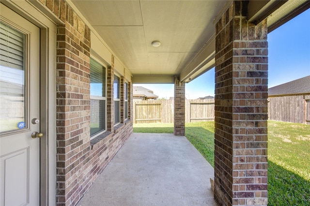 view of patio / terrace featuring fence
