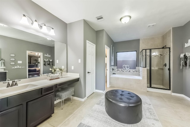 full bathroom with a garden tub, double vanity, tile patterned floors, a shower stall, and a sink