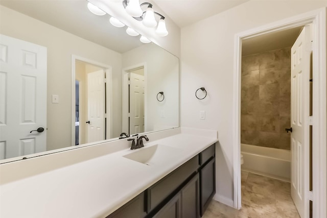 bathroom featuring vanity, toilet, and tub / shower combination