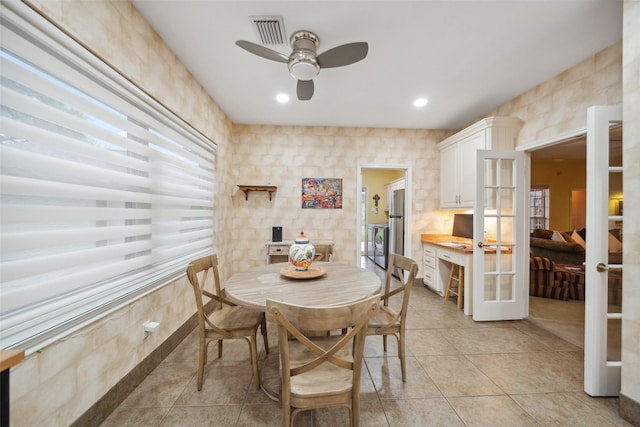 12538 W Pavilion Ct W, Tomball, TX 77377 - dining space with french doors, ceiling fan, and light tile patterned floors