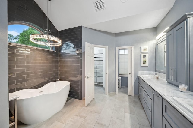 12538 W Pavilion Ct W, Tomball, TX 77377 - full bath featuring a soaking tub, healthy amount of natural light, and double vanity