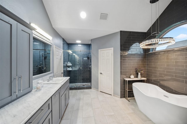 12538 W Pavilion Ct W, Tomball, TX 77377 - bathroom with a shower stall, a soaking tub, vanity, and tile patterned flooring