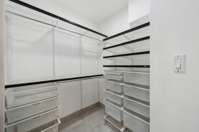 12538 W Pavilion Ct W, Tomball, TX 77377 - walk in closet with light tile patterned flooring