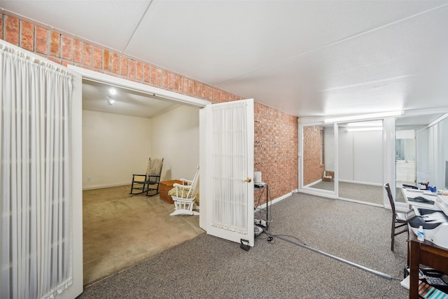 12538 W Pavilion Ct W, Tomball, TX 77377 - finished basement featuring brick wall, carpet, and baseboards