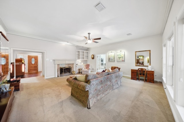 12538 W Pavilion Ct W, Tomball, TX 77377 - living room featuring crown molding, light carpet, ceiling fan, a fireplace, and baseboards
