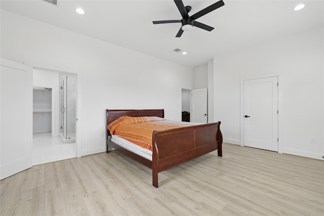 bedroom featuring light wood-style flooring, a ceiling fan, visible vents, recessed lighting, and baseboards