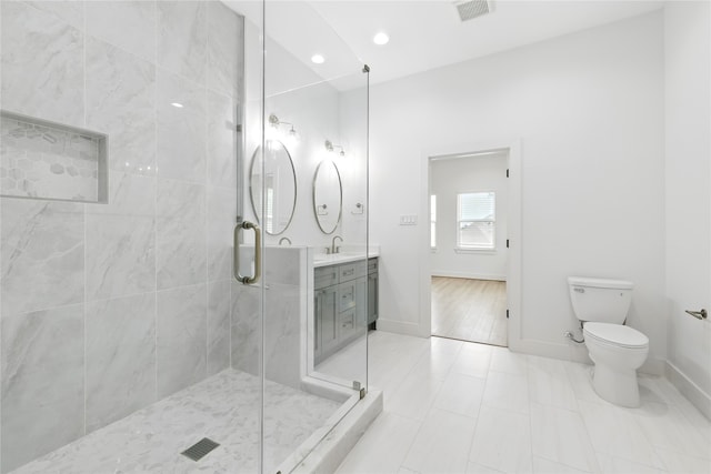 full bathroom featuring visible vents, baseboards, toilet, a shower stall, and tile patterned flooring