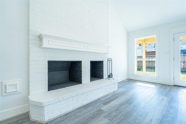8006 17th Green Dr, Humble, TX 77346 - interior details featuring a fireplace, baseboards, and wood finished floors