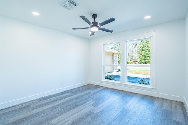 8006 17th Green Dr, Humble, TX 77346 - empty room with recessed lighting, baseboards, and wood finished floors