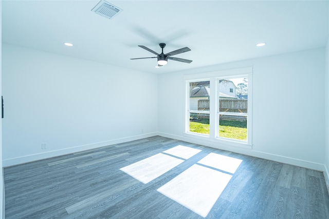 8006 17th Green Dr, Humble, TX 77346 - unfurnished room featuring wood finished floors, baseboards, visible vents, and recessed lighting