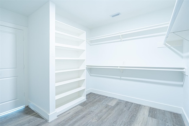 8006 17th Green Dr, Humble, TX 77346 - spacious closet with visible vents and wood finished floors