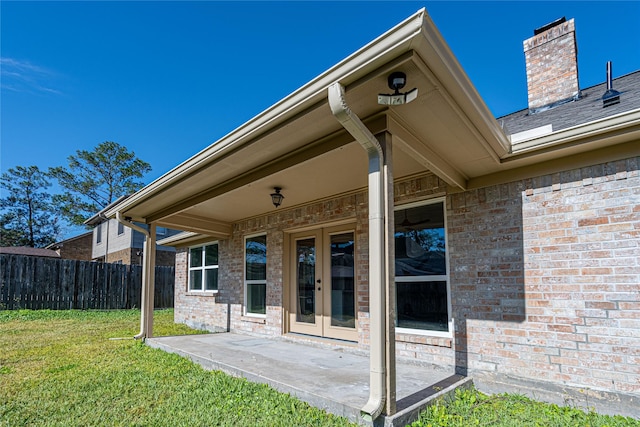 8006 17th Green Dr, Humble, TX 77346 - back of property with a patio, french doors, brick siding, a yard, and fence