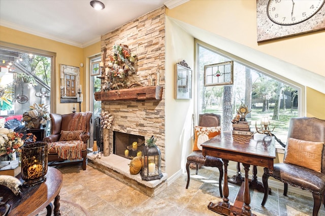 53 Litchfield Ln, Houston, TX 77024 - sitting room featuring ornamental molding and a stone fireplace