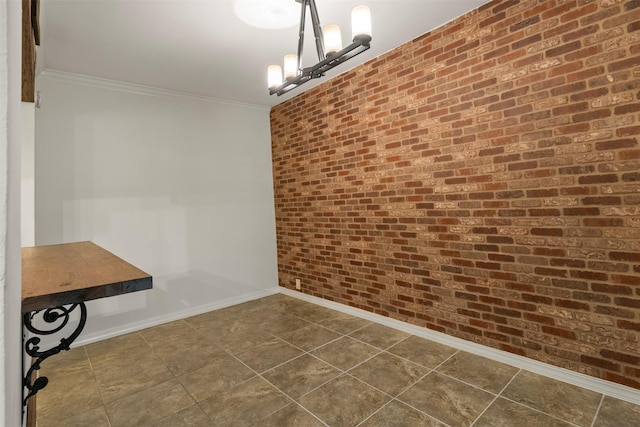 53 Litchfield Ln, Houston, TX 77024 - unfurnished dining area featuring crown molding, baseboards, dark tile patterned floors, a chandelier, and brick wall