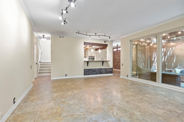 53 Litchfield Ln, Houston, TX 77024 - unfurnished living room with track lighting, ornamental molding, and baseboards
