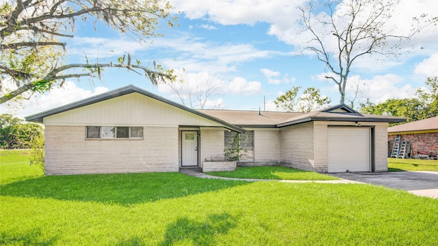 single story home with a garage, driveway, a front lawn, and brick siding