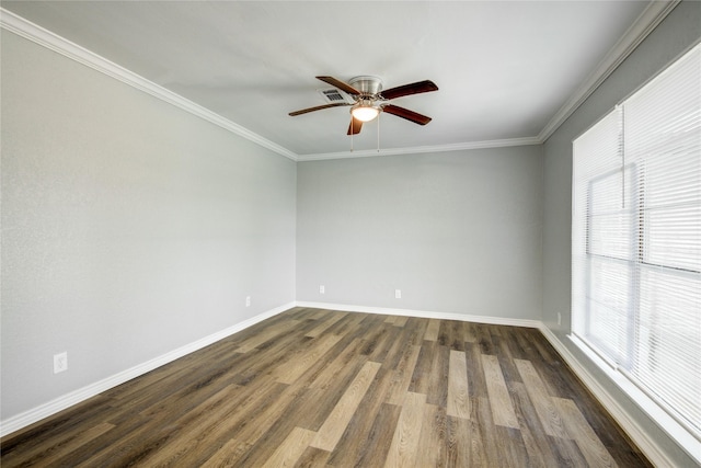 spare room with a wealth of natural light, a ceiling fan, and baseboards
