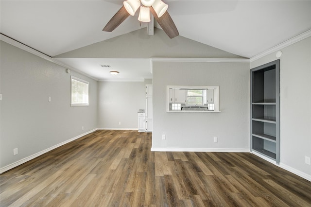 unfurnished living room featuring visible vents, lofted ceiling with beams, a ceiling fan, dark wood finished floors, and crown molding