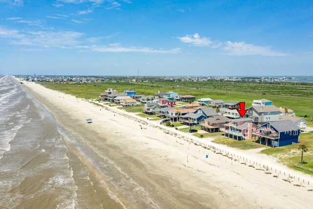 bird's eye view with a water view and a view of the beach