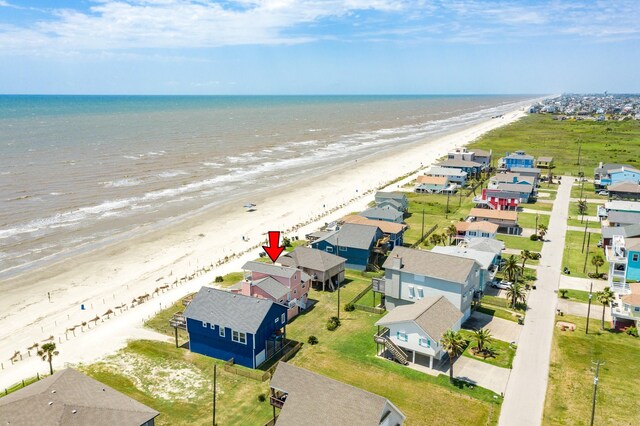 bird's eye view with a water view and a view of the beach