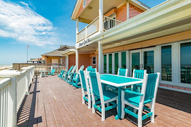 wooden deck featuring outdoor dining space