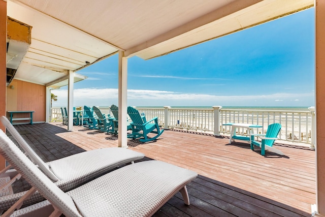 wooden deck featuring a water view
