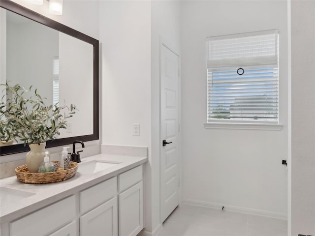 164 Peninsula Point Dr, Montgomery, TX 77356 - bathroom with double vanity, baseboards, and tile patterned flooring
