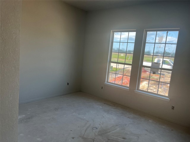 164 Peninsula Point Dr, Montgomery, TX 77356 - spare room featuring plenty of natural light and unfinished concrete flooring