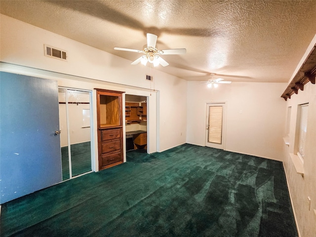 106 Jordan Ave, Cleveland, TX 77327 - unfurnished bedroom with a textured ceiling, carpet flooring, two closets, and visible vents
