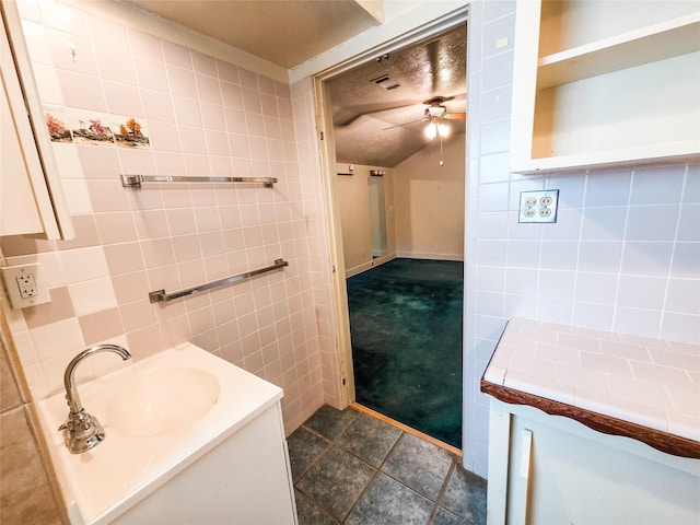 106 Jordan Ave, Cleveland, TX 77327 - bathroom with tile walls, a ceiling fan, and vanity