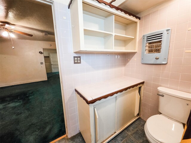 106 Jordan Ave, Cleveland, TX 77327 - bathroom with tile walls, toilet, and ceiling fan