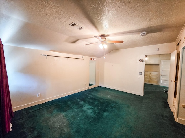 106 Jordan Ave, Cleveland, TX 77327 - empty room featuring dark carpet, a ceiling fan, visible vents, lofted ceiling, and baseboards