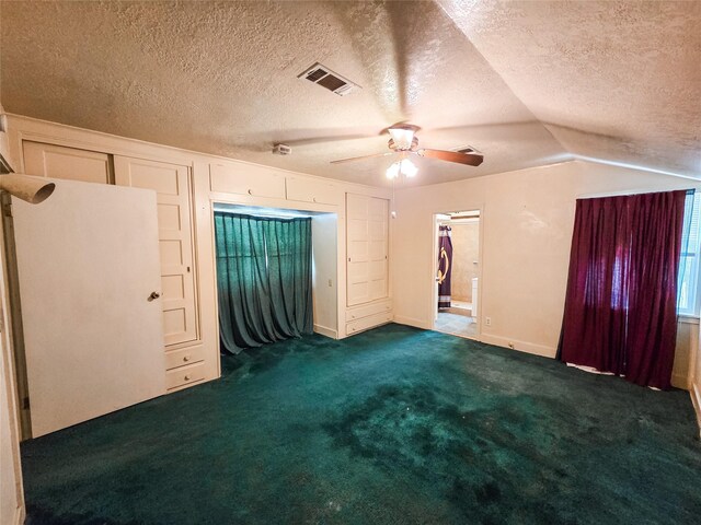 106 Jordan Ave, Cleveland, TX 77327 - empty room featuring visible vents, dark carpet, ceiling fan, a textured ceiling, and vaulted ceiling