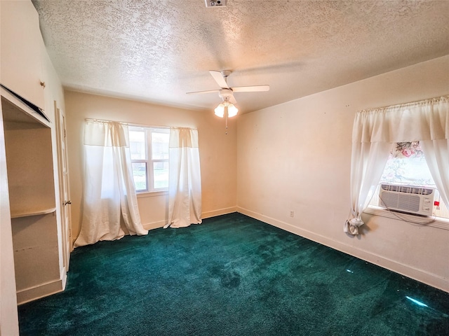 106 Jordan Ave, Cleveland, TX 77327 - unfurnished room with cooling unit, a textured ceiling, a ceiling fan, dark colored carpet, and baseboards