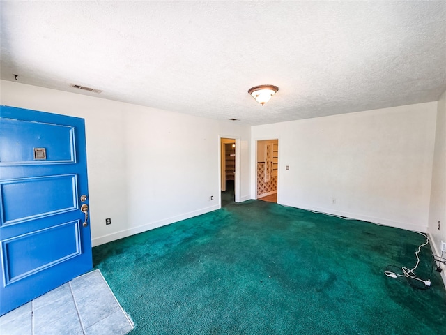 106 Jordan Ave, Cleveland, TX 77327 - spare room with visible vents, baseboards, carpet, and a textured ceiling