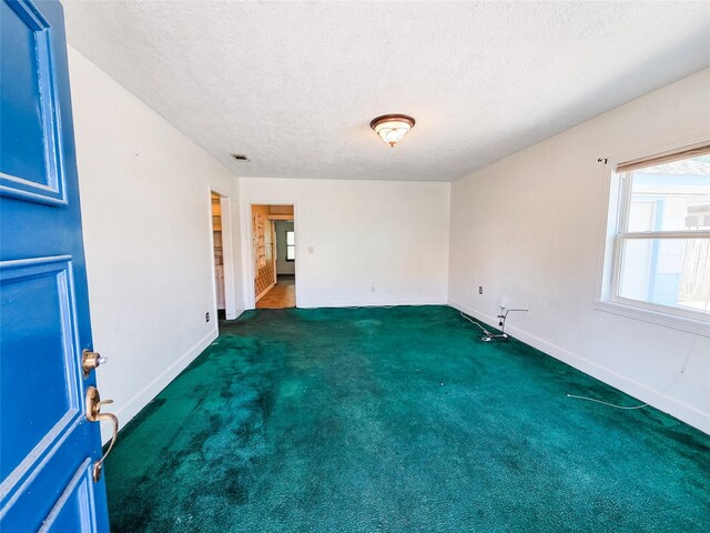 106 Jordan Ave, Cleveland, TX 77327 - empty room featuring visible vents, a textured ceiling, baseboards, and carpet floors