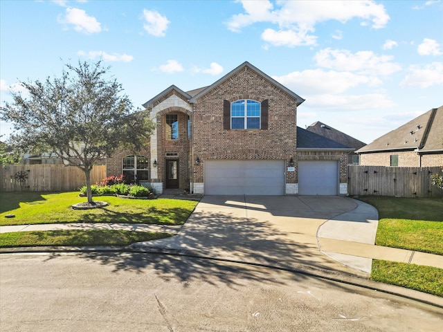 6303 Wood Creek Ln, League City, TX 77573 - traditional home with a front yard, brick siding, driveway, and fence