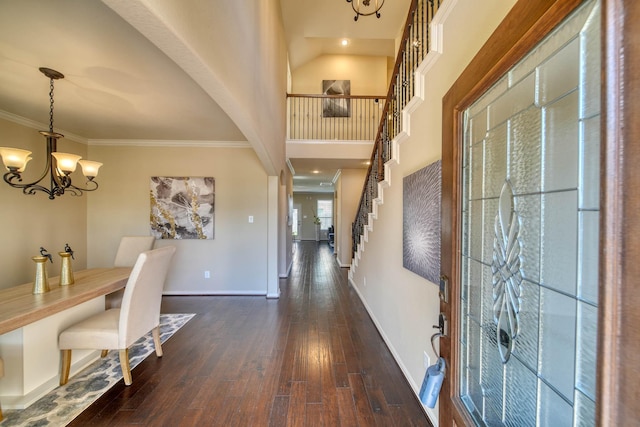 6303 Wood Creek Ln, League City, TX 77573 - foyer entrance featuring stairs, dark wood-type flooring, baseboards, and an inviting chandelier