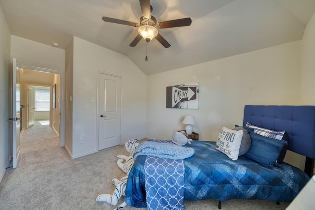 6303 Wood Creek Ln, League City, TX 77573 - bedroom with ceiling fan, carpet flooring, baseboards, and lofted ceiling