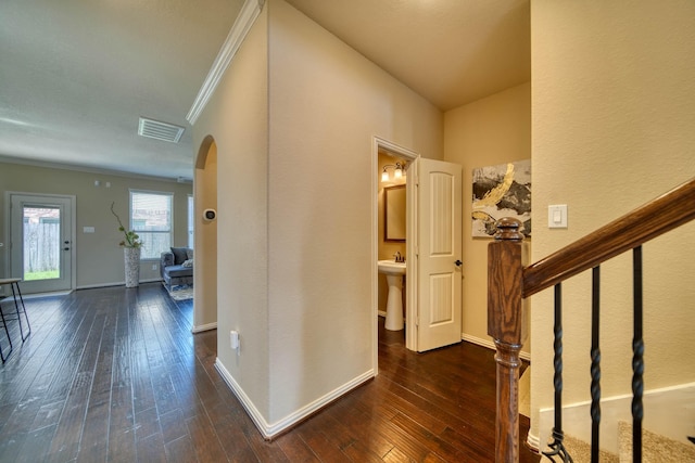 6303 Wood Creek Ln, League City, TX 77573 - interior space with crown molding, dark wood finished floors, arched walkways, visible vents, and stairway