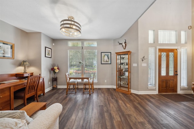 14832 Oak Shores Dr, Willis, TX 77318 - entrance foyer featuring wood finished floors, a chandelier, and baseboards