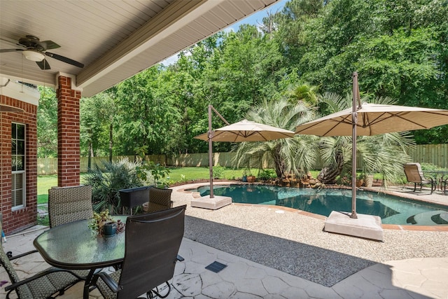 14832 Oak Shores Dr, Willis, TX 77318 - view of swimming pool with a patio, outdoor dining space, a fenced backyard, and a ceiling fan