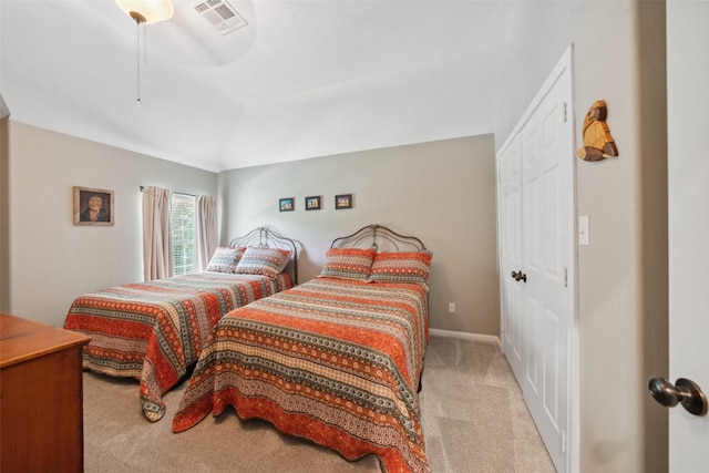 14832 Oak Shores Dr, Willis, TX 77318 - carpeted bedroom with vaulted ceiling, a ceiling fan, and a closet