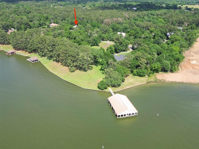 14832 Oak Shores Dr, Willis, TX 77318 - drone / aerial view of a nearby body of water and a heavily wooded area