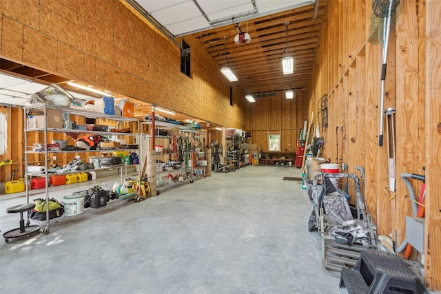 14832 Oak Shores Dr, Willis, TX 77318 - garage with a workshop area and a garage door opener