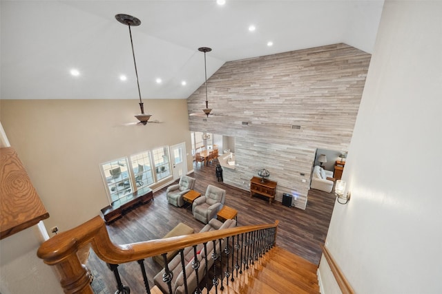 14832 Oak Shores Dr, Willis, TX 77318 - stairway with wood finished floors, high vaulted ceiling, a ceiling fan, and recessed lighting