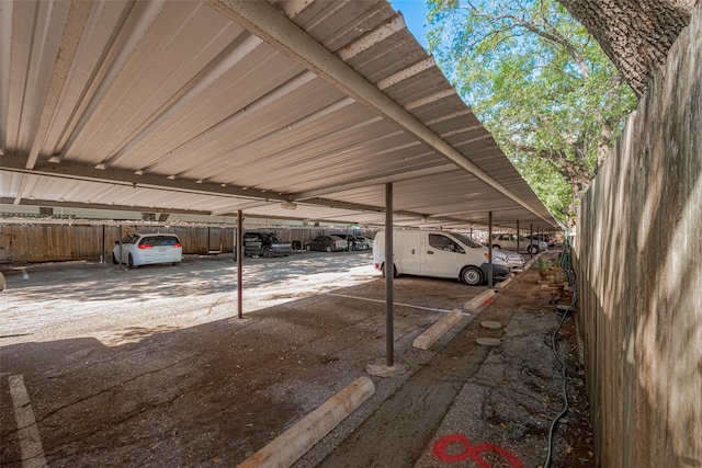 covered parking lot with fence